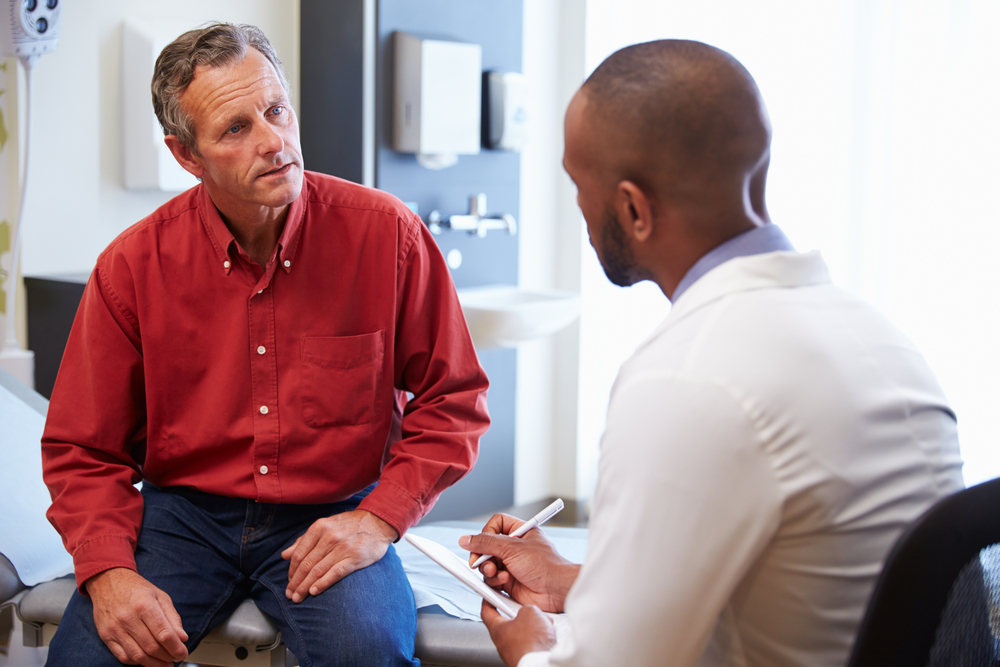 A man talking to his doctor.