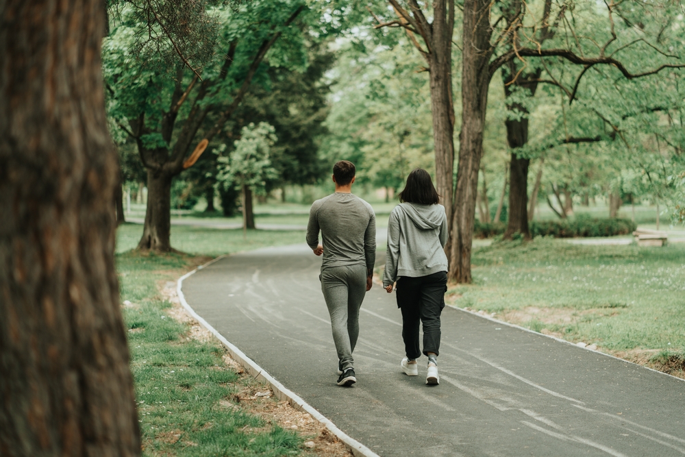A couple on a walk outside.